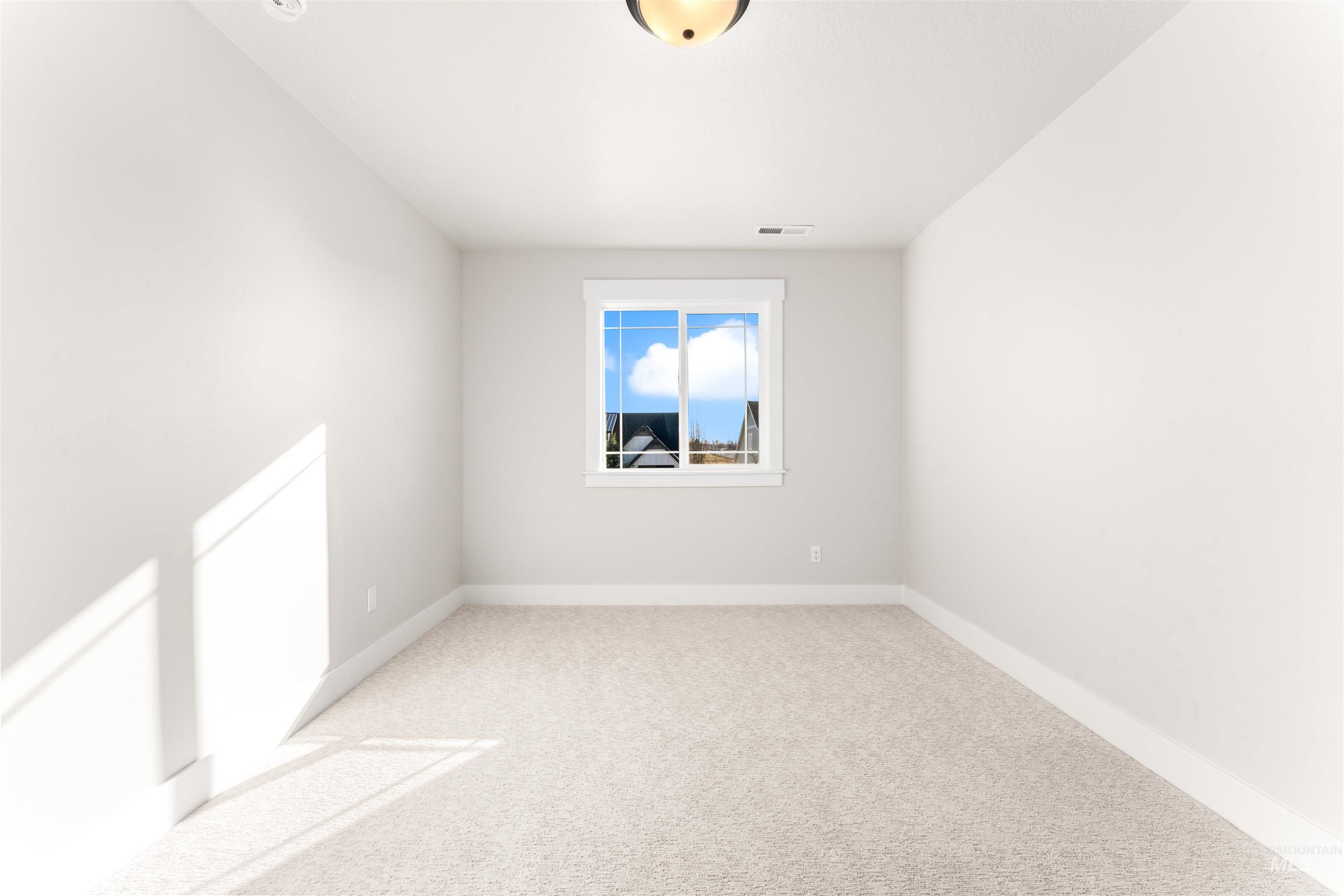 8084 Tandy Cv Street Middleton, ID 83644 - Photo 33 of 46 Spare room with light colored carpet and baseboards