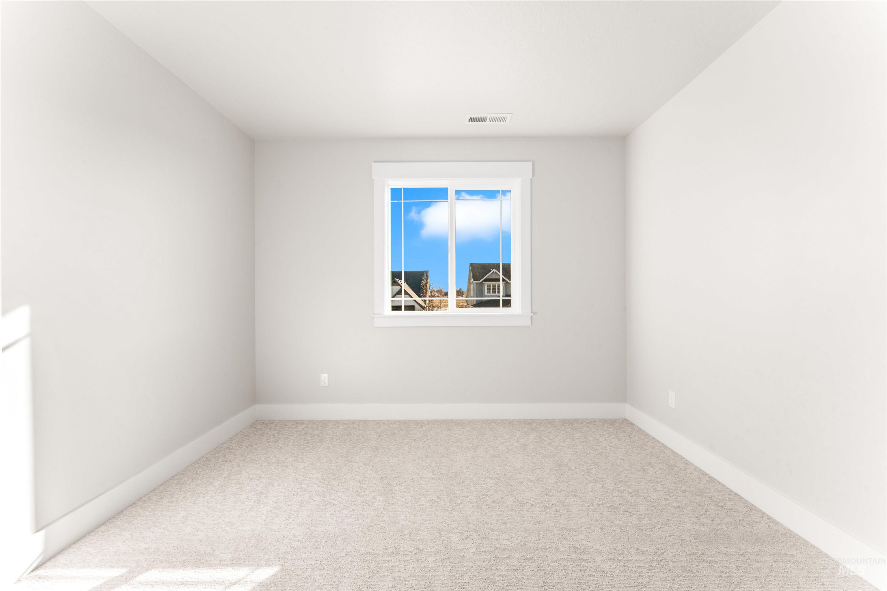 8084 Tandy Cv Street Middleton, ID 83644 - Photo 35 of 46 Empty room featuring light colored carpet and baseboards