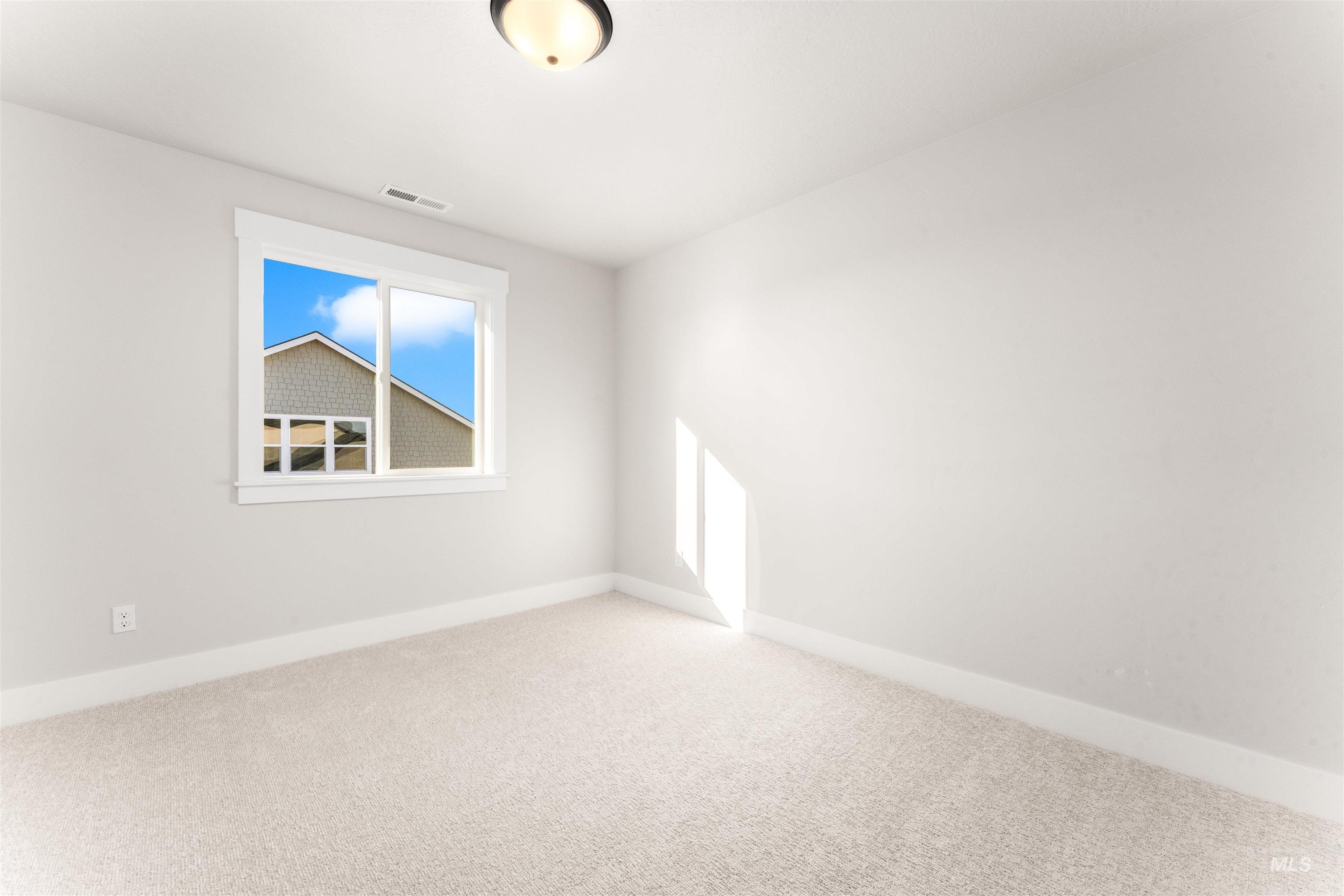 8084 Tandy Cv Street Middleton, ID 83644 - Photo 36 of 46 Spare room featuring light colored carpet and baseboards