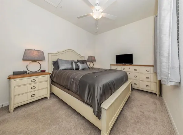 a bathroom with a shower sink and mirror