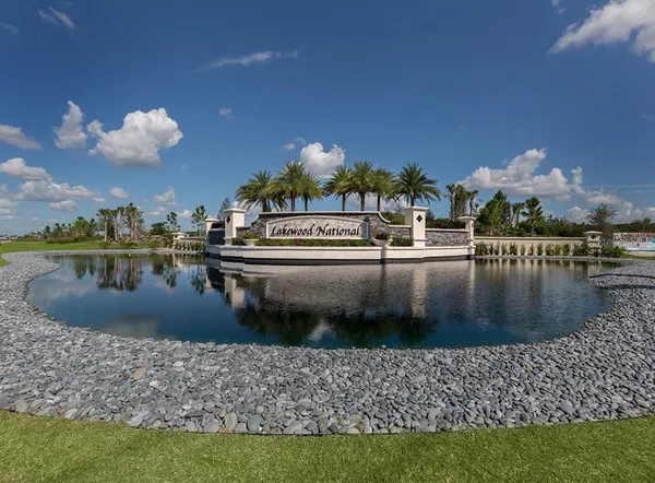 a front view of multiple houses with yard