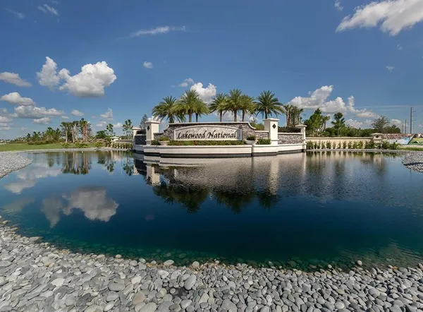 a view of a swimming pool with a yard