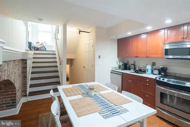 a kitchen with a appliances and cabinets
