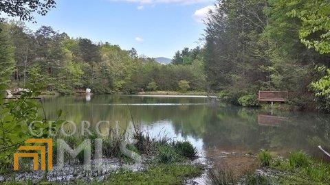 62 Cherry Lake Blue Ridge, GA 30513 - Photo 1 of 1 a view of a lake with a house in the background