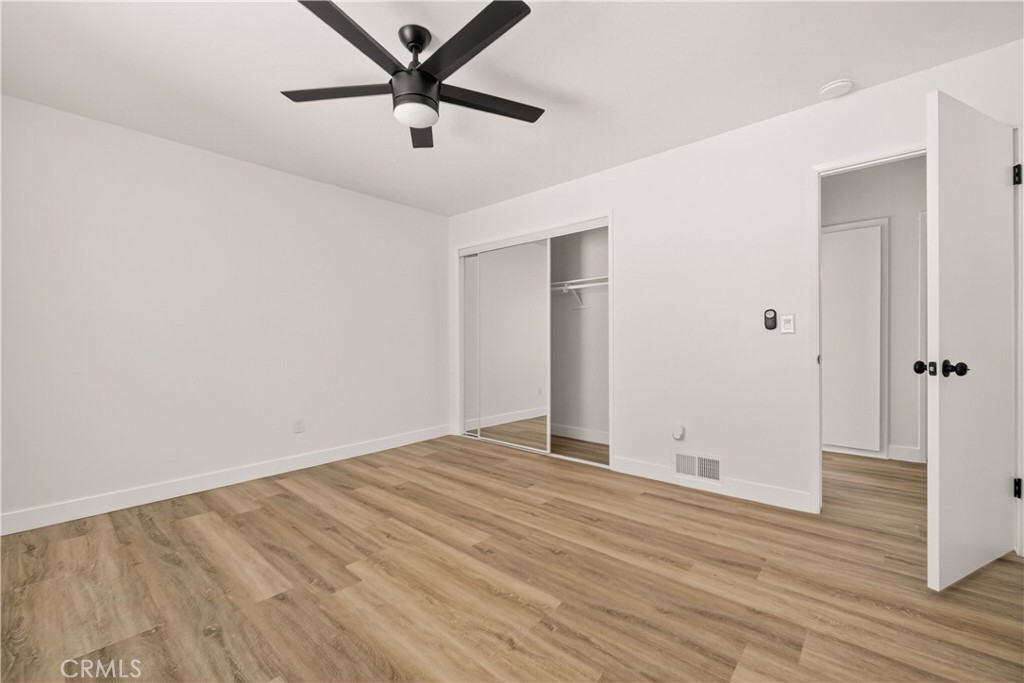 700 West Gonzales Road, Unit F Oxnard, CA 93036 - Photo 3 of 14 wooden floor in an empty room