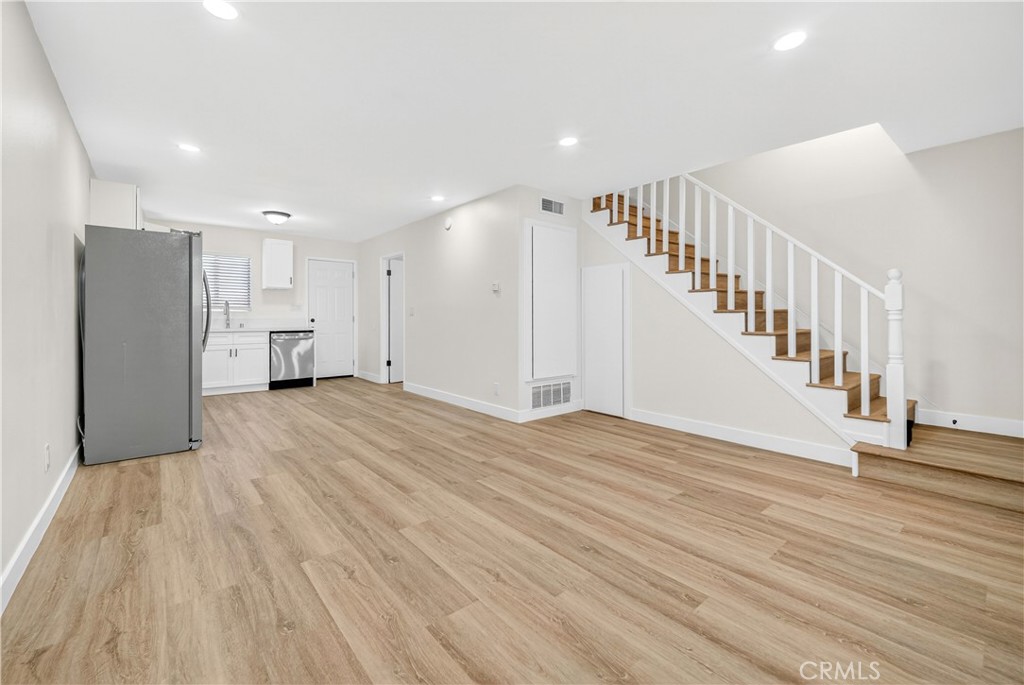 700 West Gonzales Road, Unit F Oxnard, CA 93036 - Photo 7 of 14 a view of a hallway with wooden floor