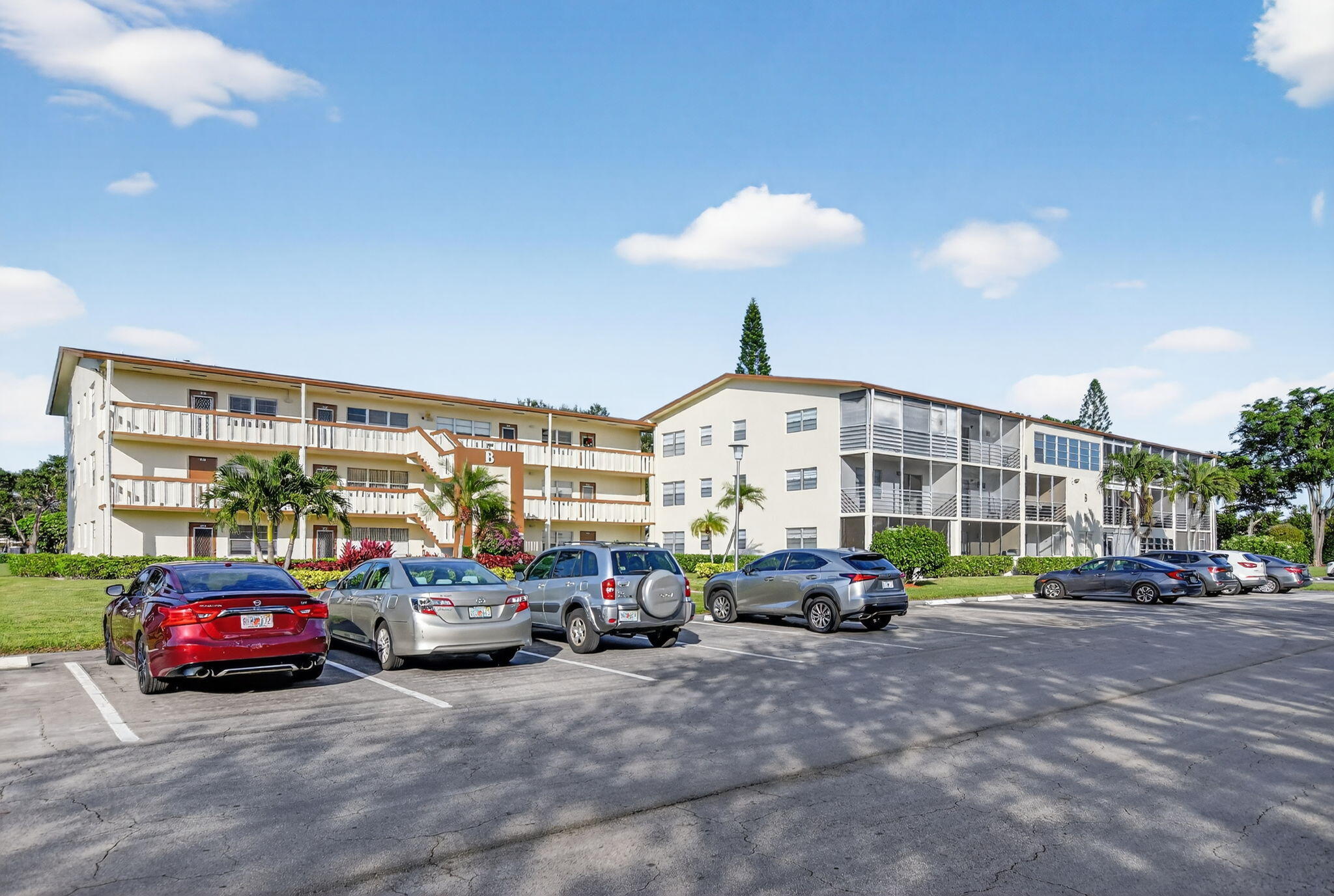 52 Mansfield B, Unit B Boca Raton, FL 33434 - Photo 1 of 49 a cars parked in front of a building