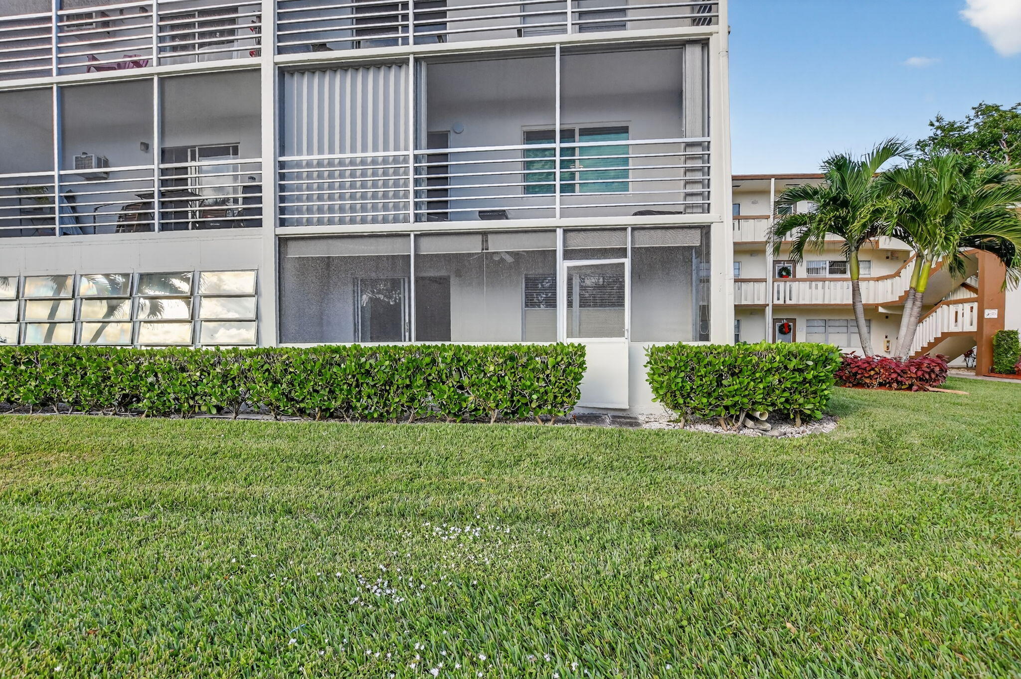 52 Mansfield B, Unit B Boca Raton, FL 33434 - Photo 23 of 49 a view of a house with a garden