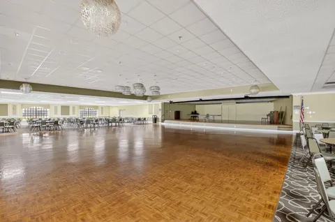 a view of a living room with hardwood floor