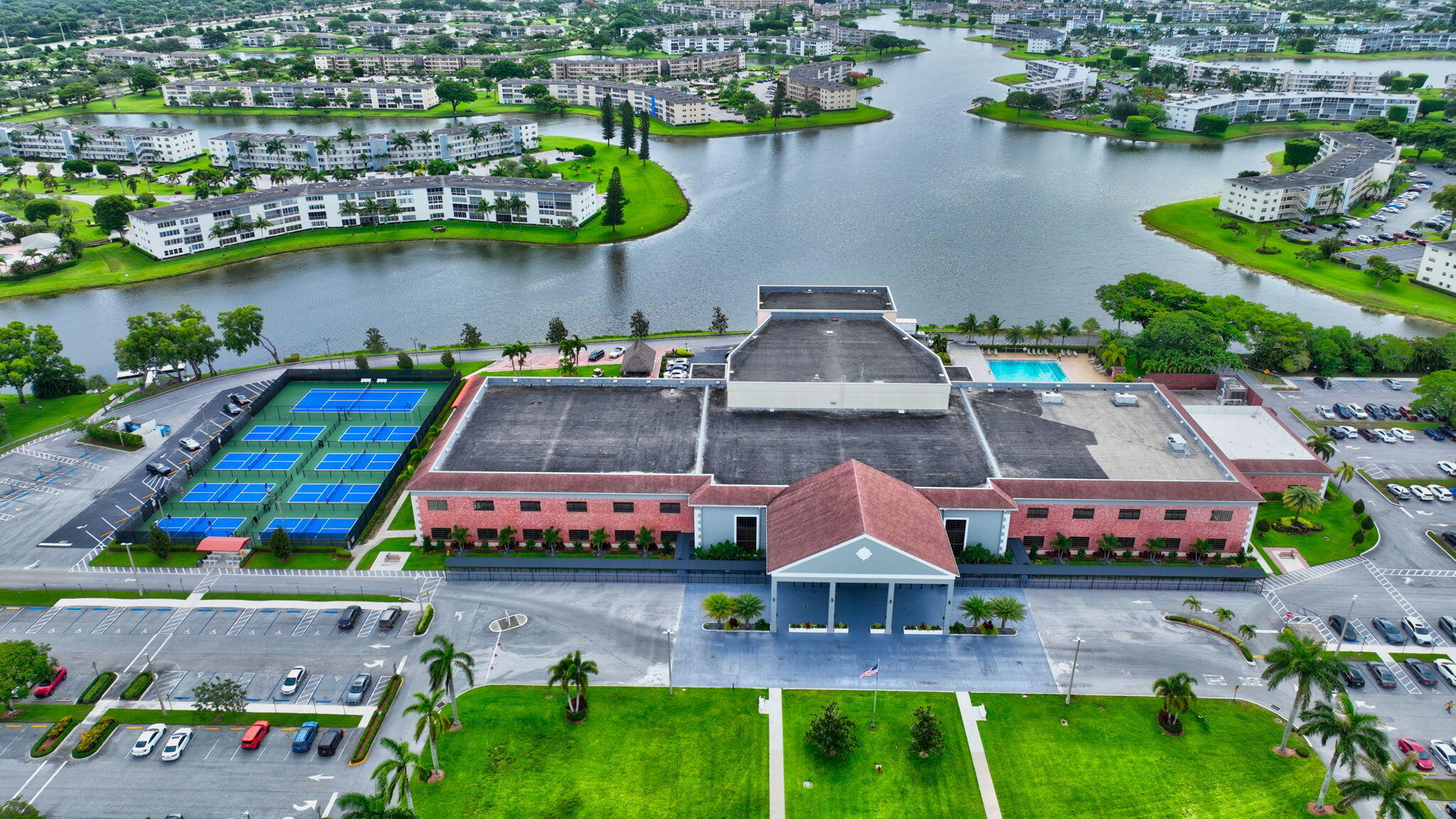 52 Mansfield B, Unit B Boca Raton, FL 33434 - Photo 40 of 49 an aerial view of a house with a garden and lake view