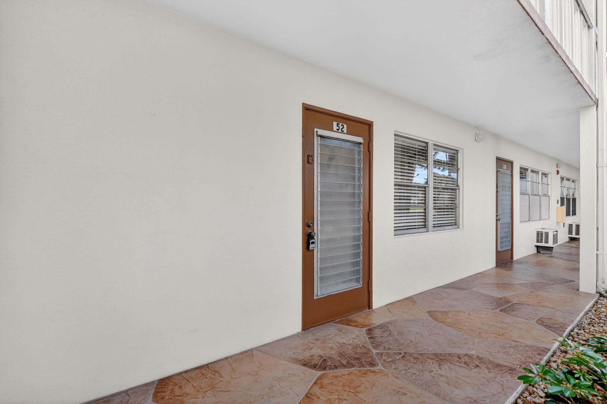 52 Mansfield B, Unit B Boca Raton, FL 33434 - Photo 4 of 49 an empty room with windows