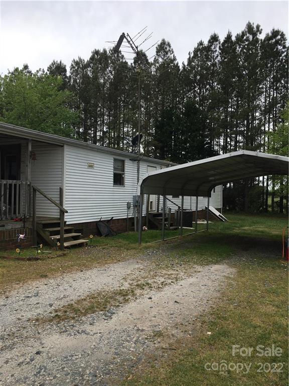 215 Linker Road Rockwell, NC 28138 - Photo 3 of 8 a view of a house with pool and a yard