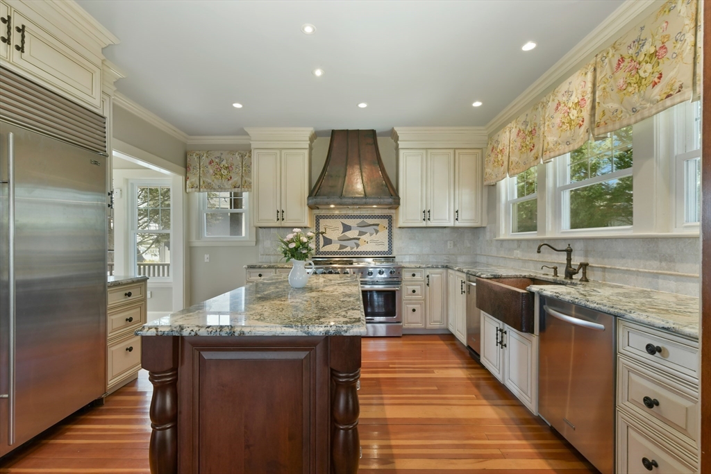 21 Beacon Road Hull, MA 02045 - Photo 15 of 40 a kitchen with stainless steel appliances granite countertop a sink stove and refrigerator