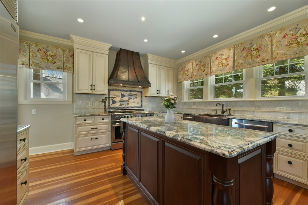 21 Beacon Road Hull, MA 02045 - Photo 16 of 40 a kitchen with a stove a sink and a refrigerator