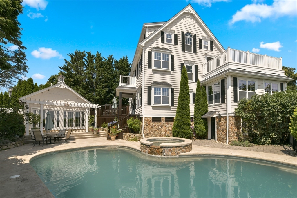 21 Beacon Road Hull, MA 02045 - Photo 2 of 40 a front view of a house with swimming pool