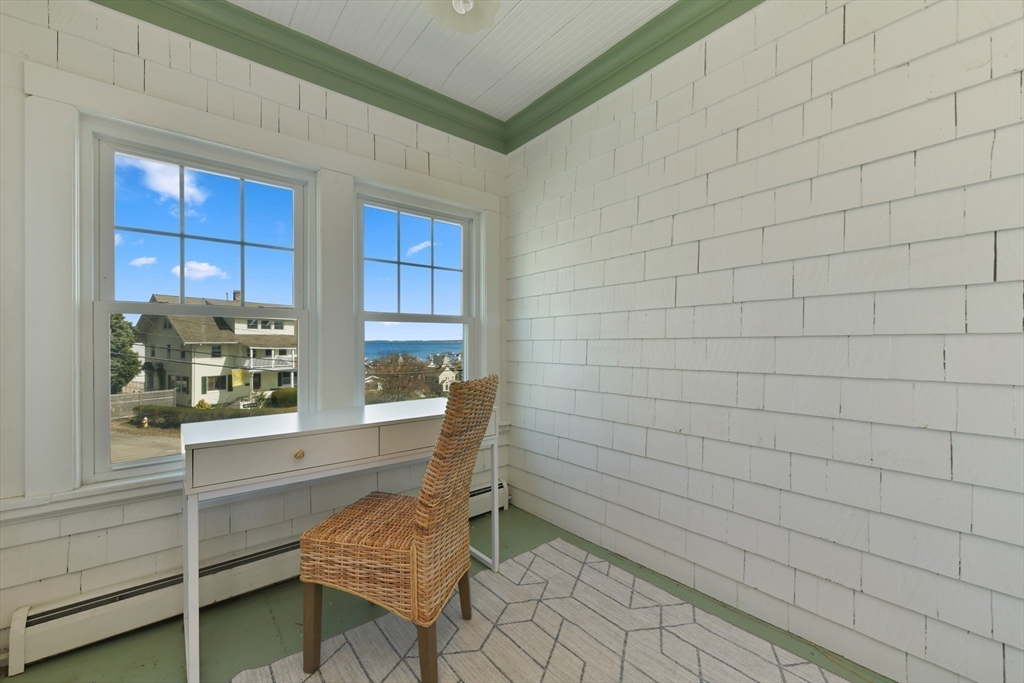 21 Beacon Road Hull, MA 02045 - Photo 26 of 40 a room with a chair and a window