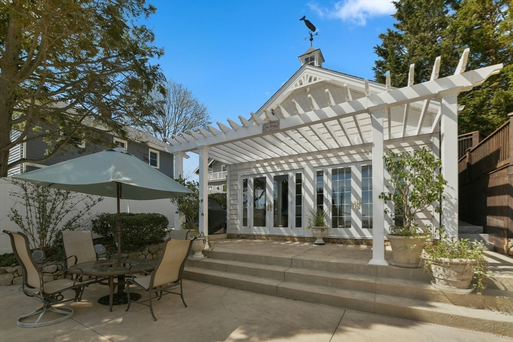21 Beacon Road Hull, MA 02045 - Photo 29 of 40 a view of a chairs and tables in the patio