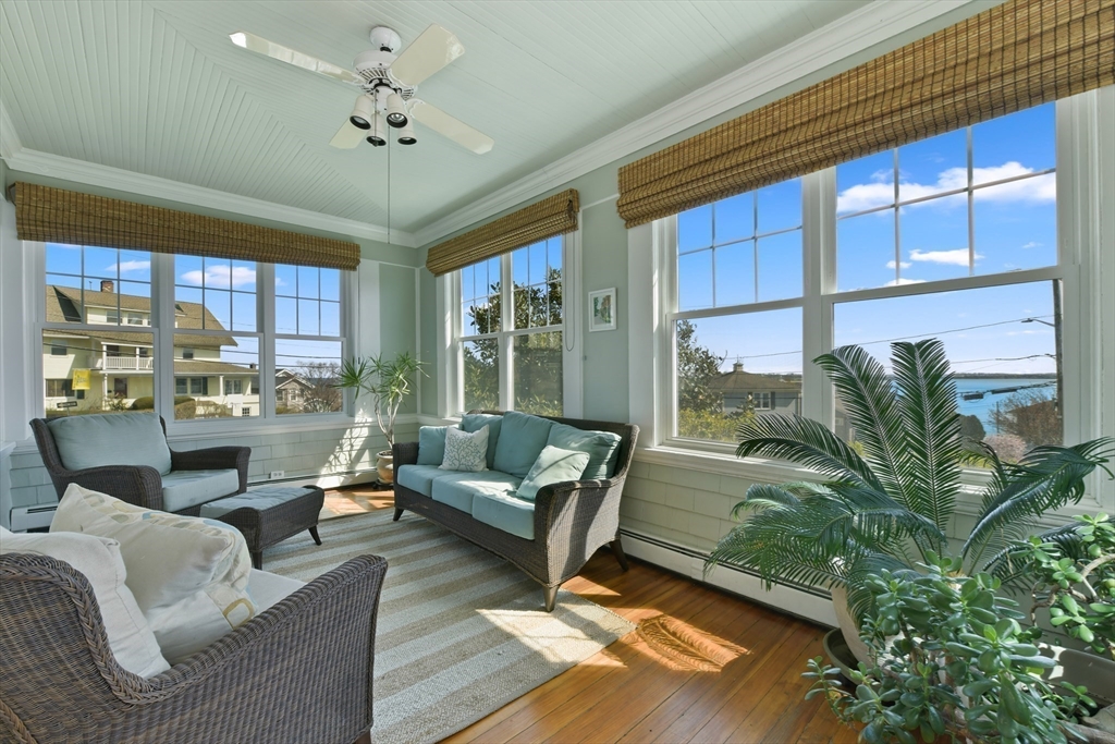21 Beacon Road Hull, MA 02045 - Photo 8 of 40 a living room with patio furniture and a floor to ceiling window