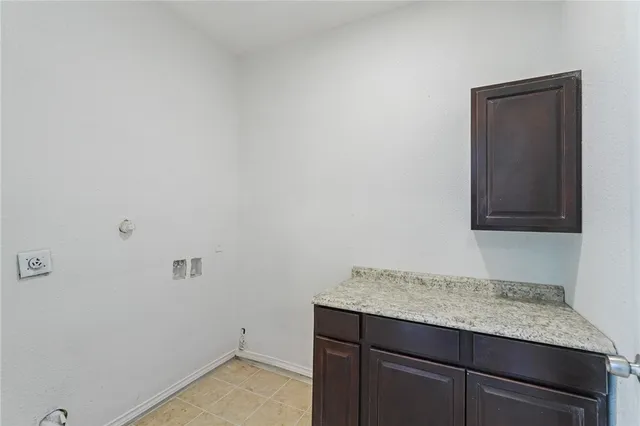 a bathroom with a granite countertop sink and vanity