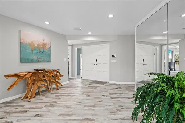 a view of a dining room with furniture and a chandelier