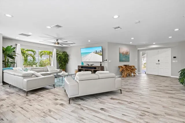 a large white kitchen with lots of counter space