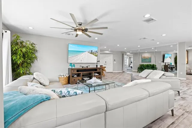 a bedroom with a bed couch and window