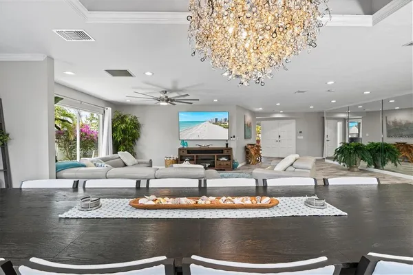 a open kitchen with stainless steel appliances granite countertop a refrigerator and a stove top oven