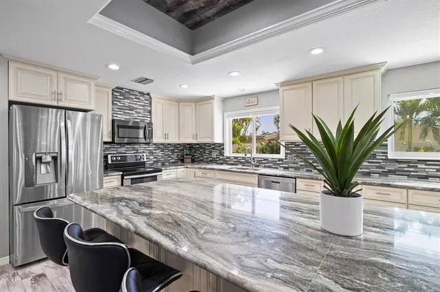 a bedroom with a bed couch and window