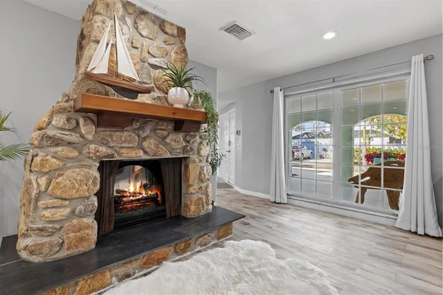 a bathroom with a sink a toilet a mirror a vanity and shower