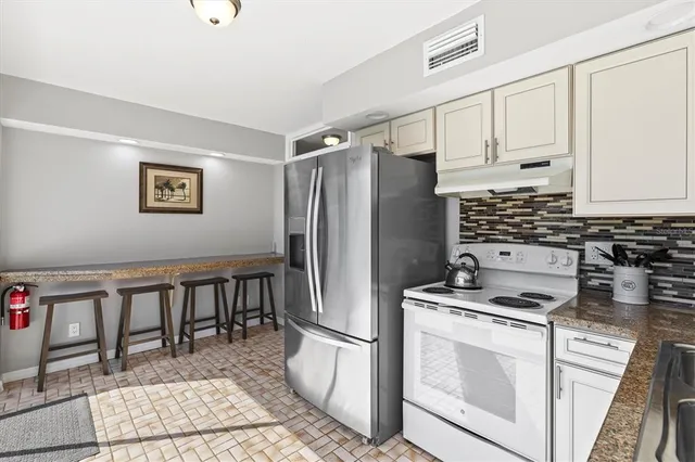 a bedroom with furniture and a large window