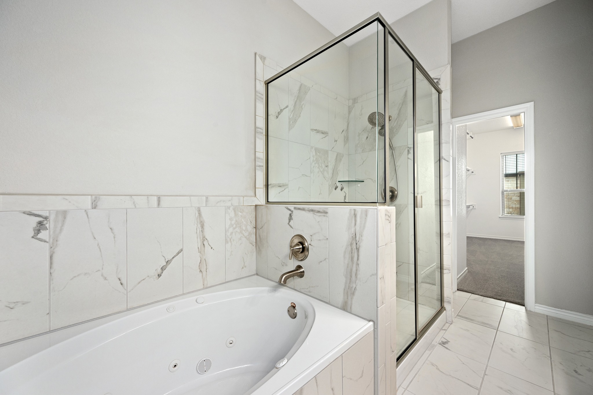 313 Adams Street Georgetown, TX 78628 - Photo 13 of 20 a bathroom with a bathtub and a shower