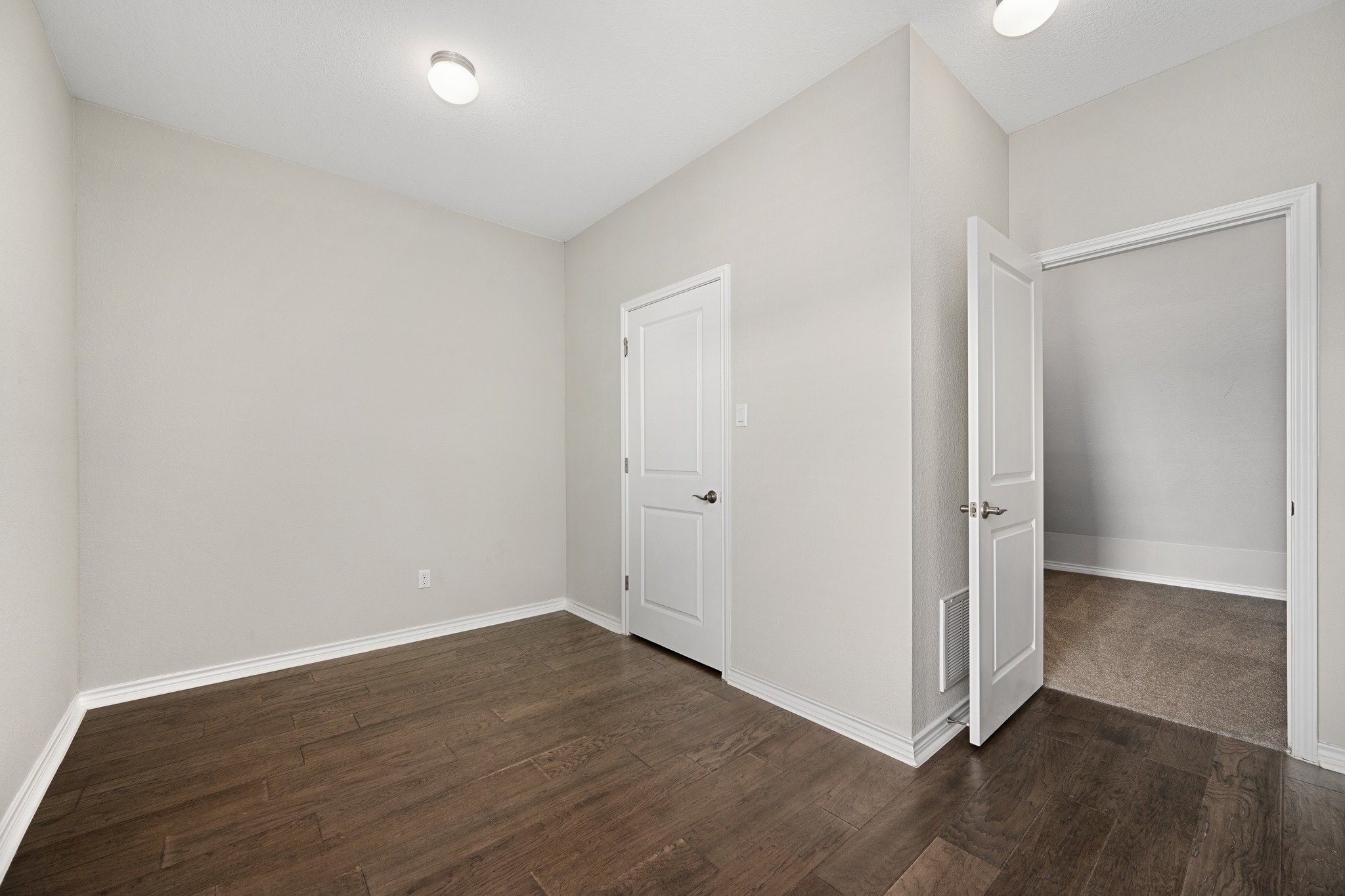 313 Adams Street Georgetown, TX 78628 - Photo 17 of 20 a view of a room with wooden floor