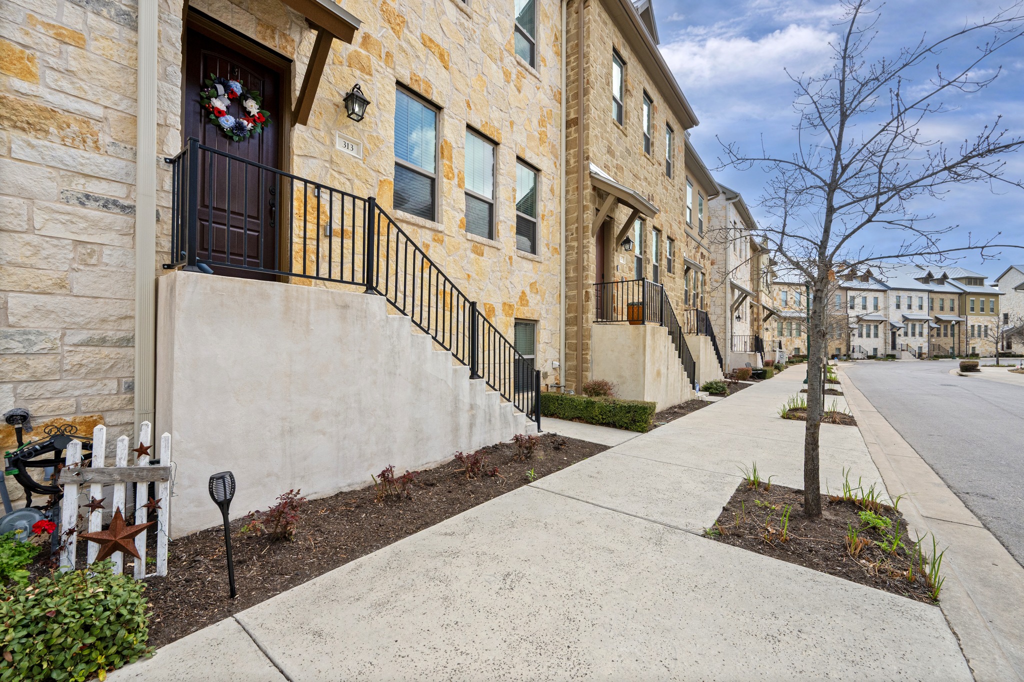 313 Adams Street Georgetown, TX 78628 - Photo 2 of 20 a view of a building with many windows