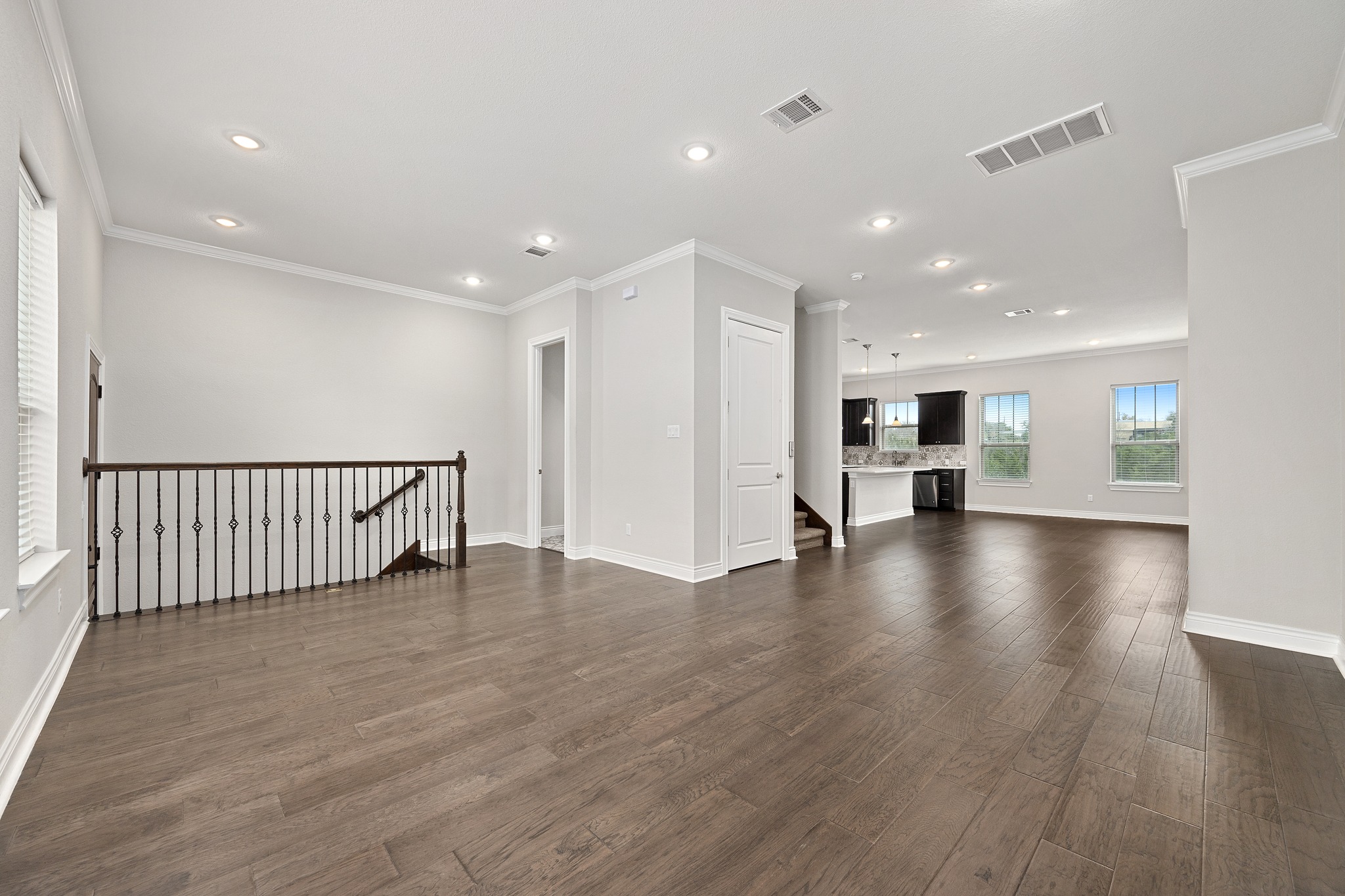 313 Adams Street Georgetown, TX 78628 - Photo 3 of 20 a view of empty room with wooden floor