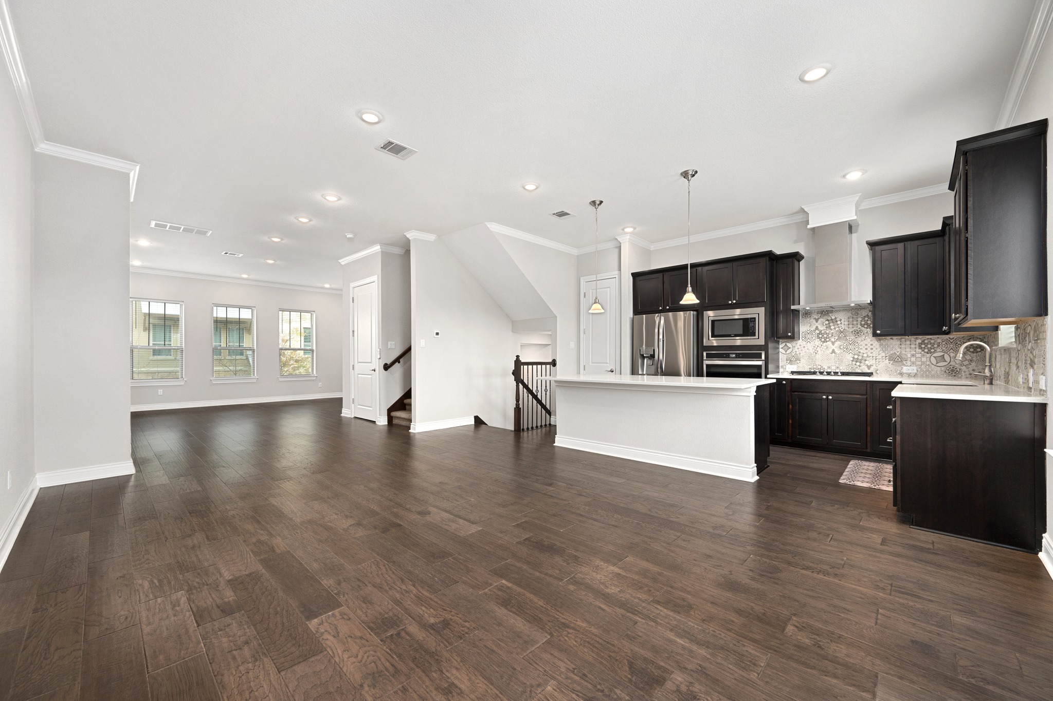 313 Adams Street Georgetown, TX 78628 - Photo 6 of 20 a view of kitchen with microwave and refrigerator