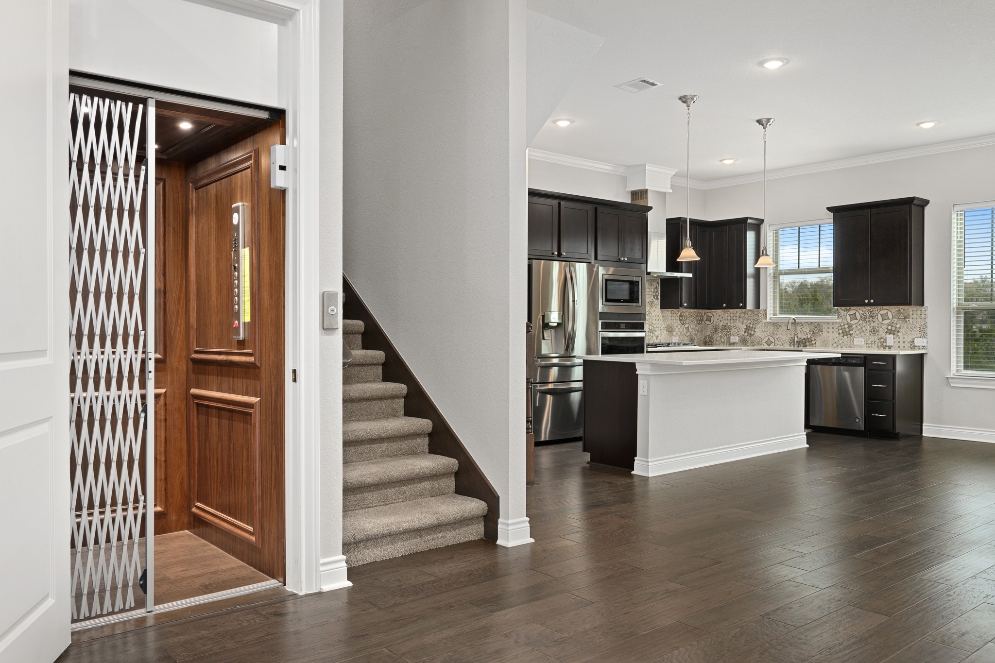 313 Adams Street Georgetown, TX 78628 - Photo 8 of 20 a view of kitchen with cabinets stainless steel appliances and wooden floor