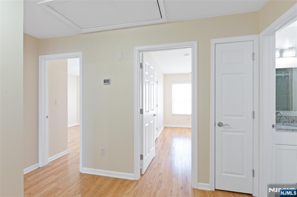 902 Spruce Street Roselle, NJ 07203 - Photo 11 of 32 a view of a hallway with wooden floor