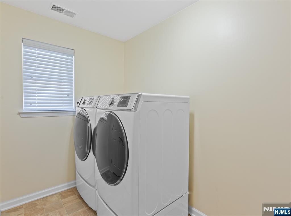 902 Spruce Street Roselle, NJ 07203 - Photo 12 of 32 a utility room with dryer and washer