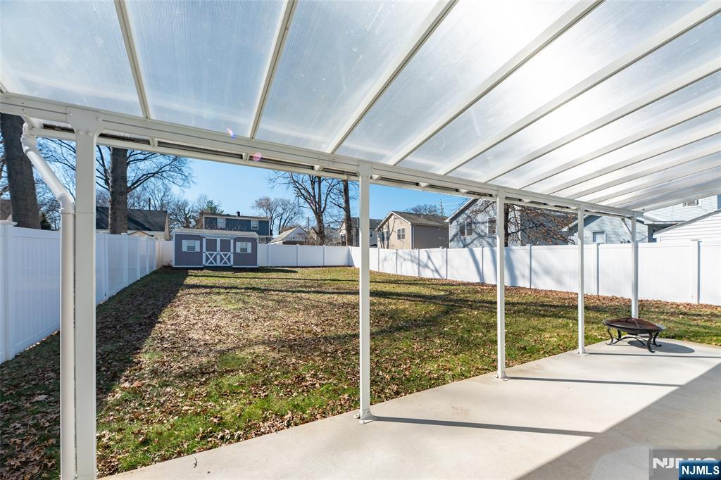 902 Spruce Street Roselle, NJ 07203 - Photo 24 of 32 a room with lots of tall trees