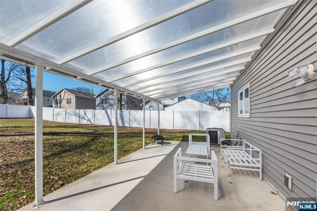902 Spruce Street Roselle, NJ 07203 - Photo 25 of 32 a view of a patio with a table and chairs