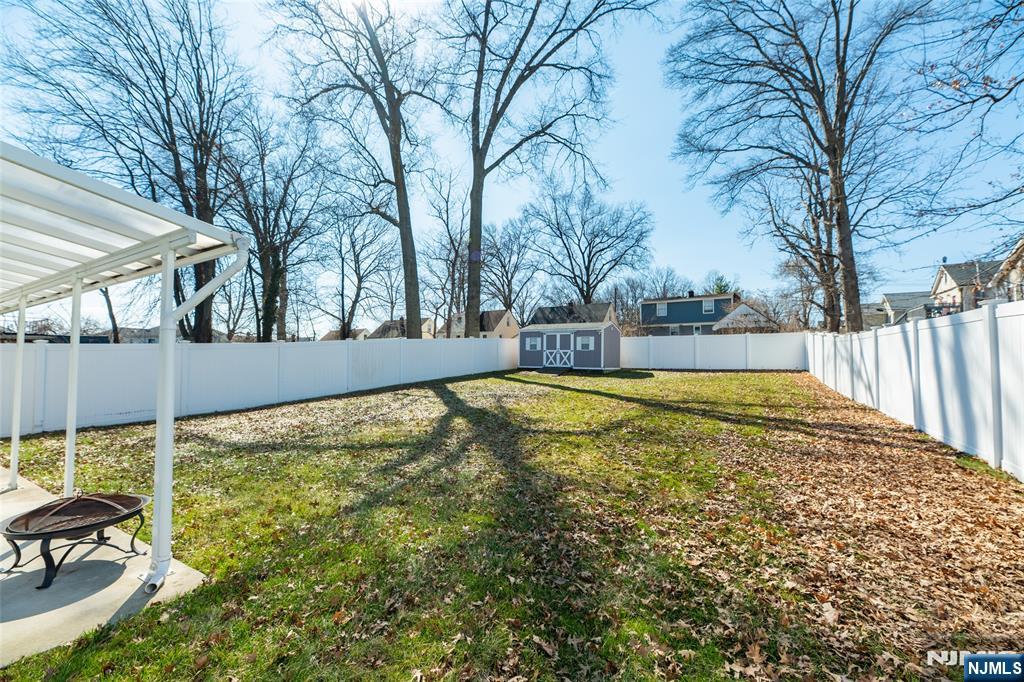 902 Spruce Street Roselle, NJ 07203 - Photo 26 of 32 a view of backyard with swimming pool and seating area