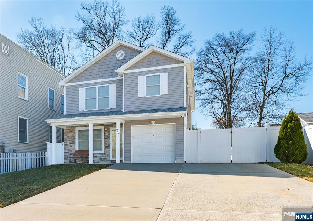 902 Spruce Street Roselle, NJ 07203 - Photo 29 of 32 a front view of a house with a yard and garage