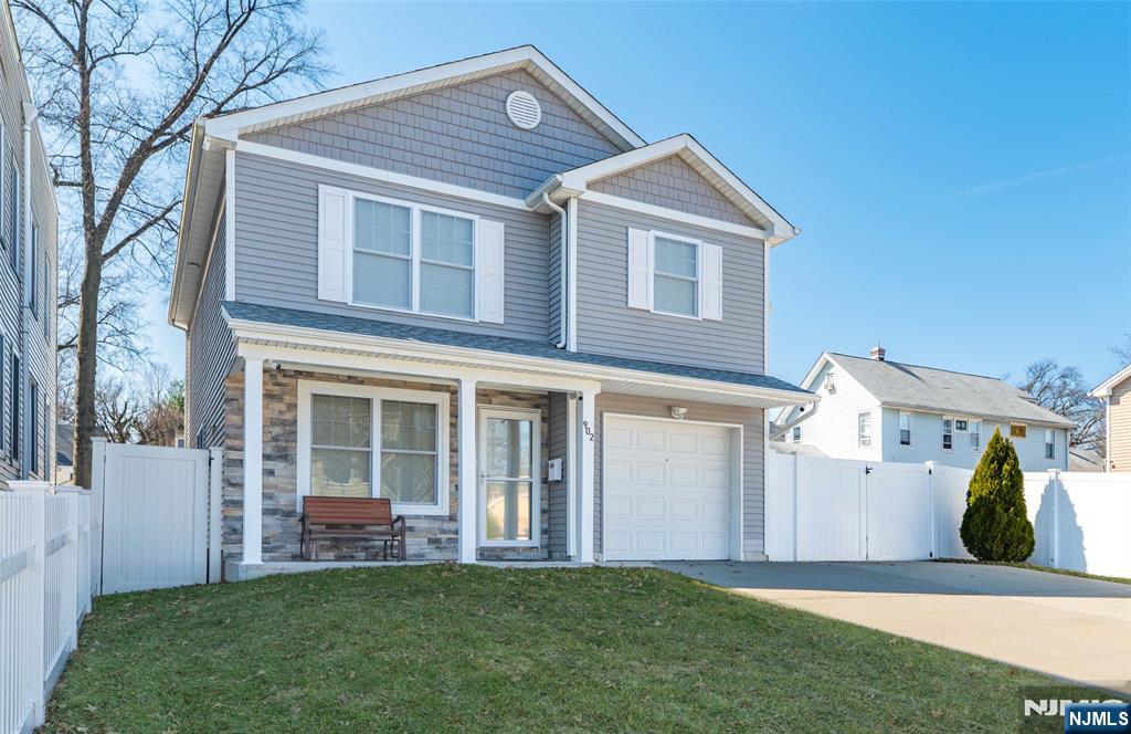902 Spruce Street Roselle, NJ 07203 - Photo 30 of 32 a view of a house with a yard