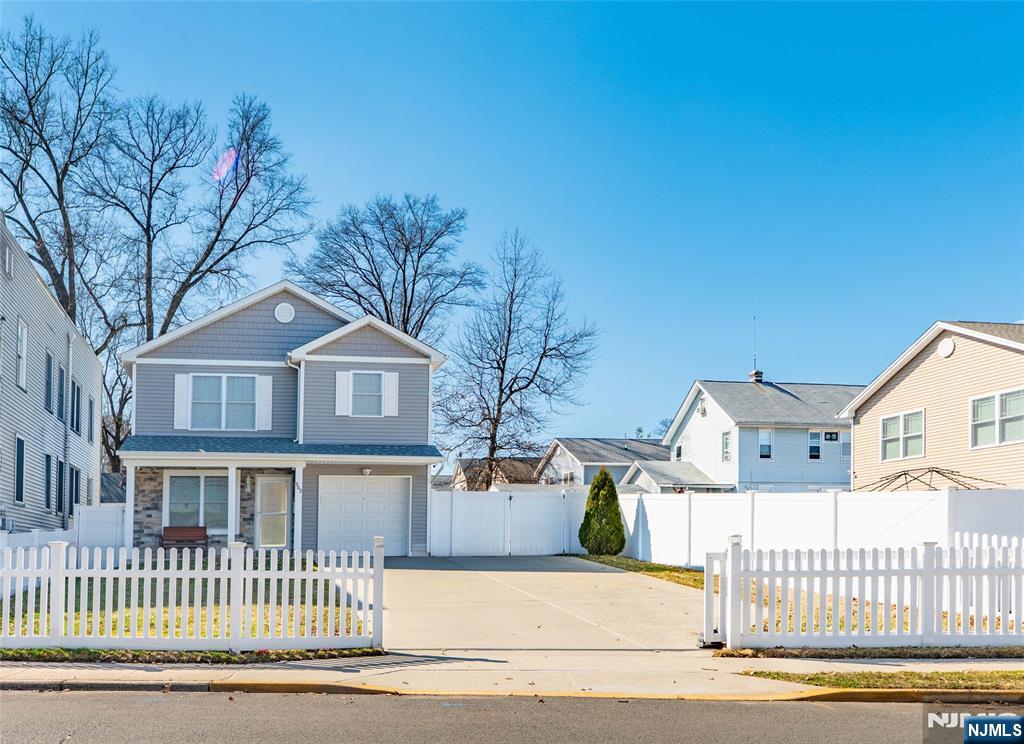 902 Spruce Street Roselle, NJ 07203 - Photo 31 of 32 front view of a house with a street