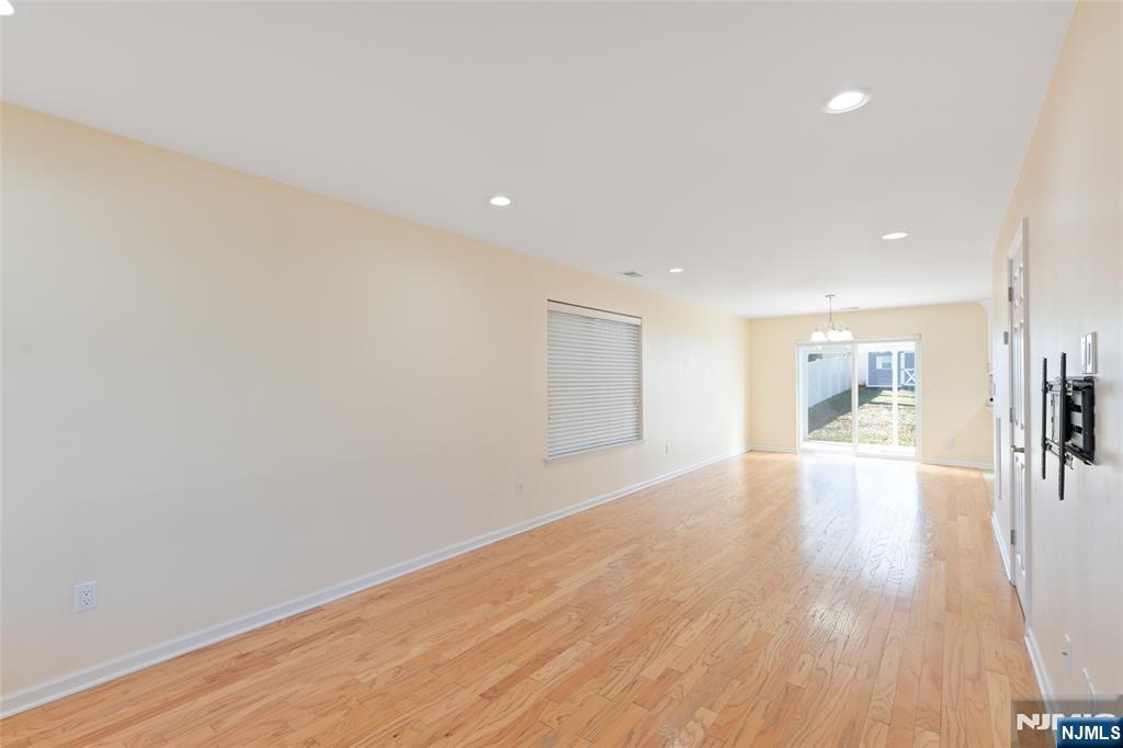 902 Spruce Street Roselle, NJ 07203 - Photo 7 of 32 a view of a hallway with wooden floor