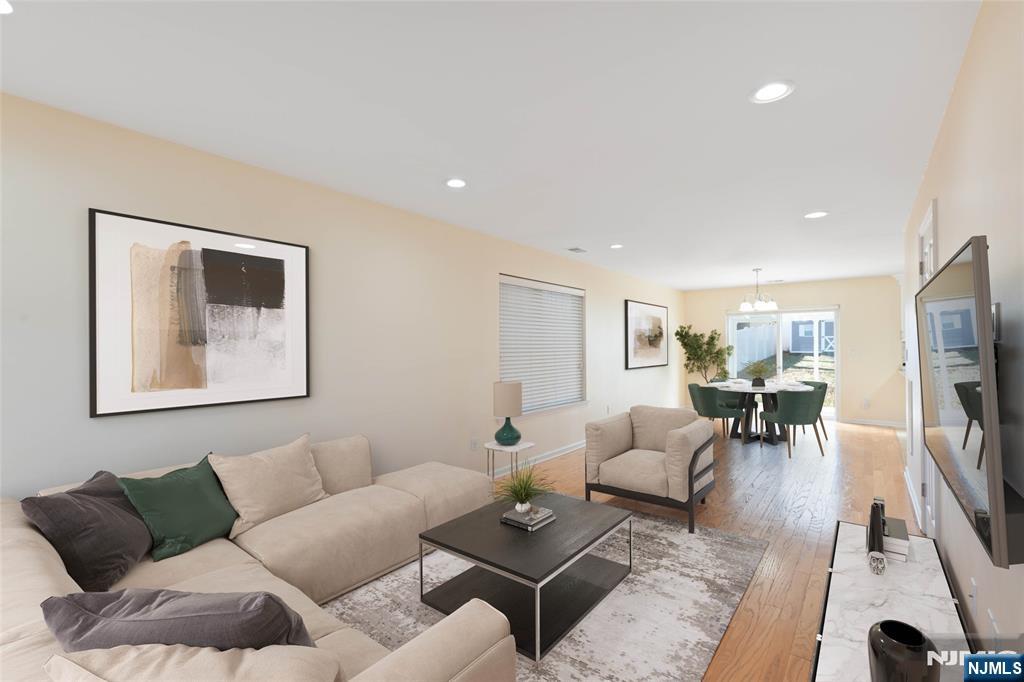 902 Spruce Street Roselle, NJ 07203 - Photo 8 of 32 a living room with furniture and a flat screen tv