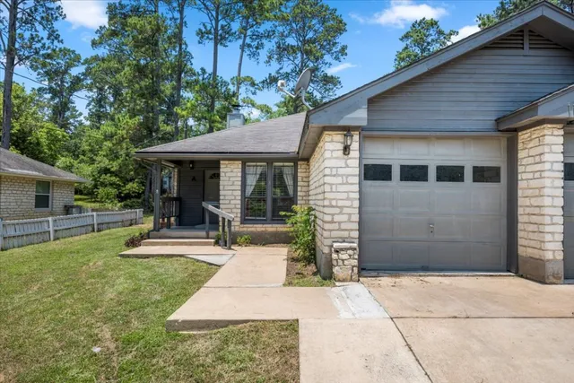a view of a house with backyard porch and sitting area