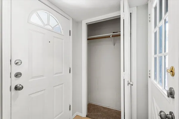 a bathroom with a glass shower door