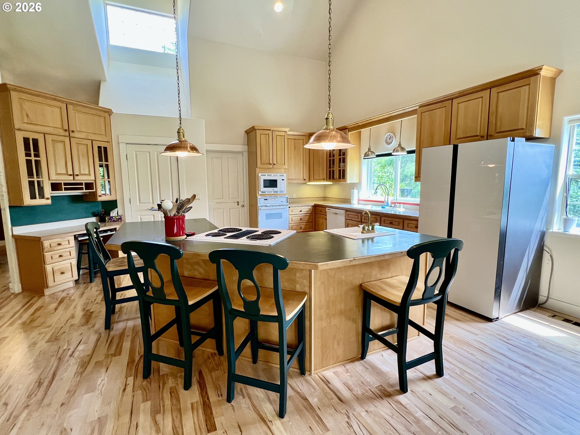 28544 Crow Road Eugene, OR 97402 - Photo 9 of 48 a table and chairs sitting in a kitchen