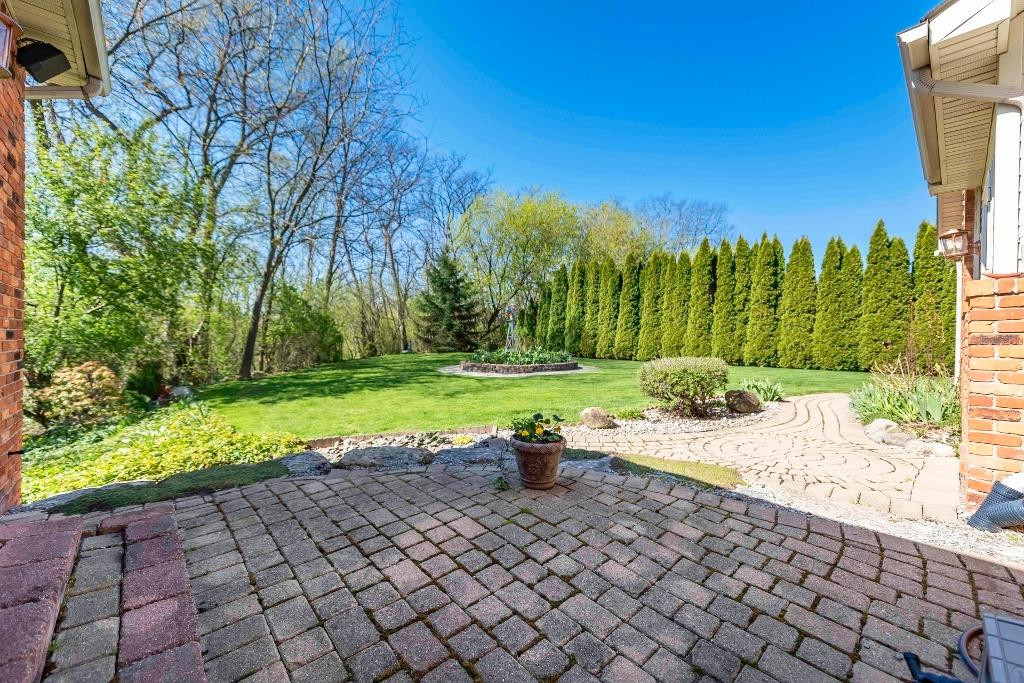 37211 Howard Road Farmington Hills, MI 48331 - Photo 18 of 83 Paver patio overlooking grassy plateau